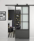 30 Inch By 84 Inch Frosted Glass Barn Door With Black Steel Frame And Three Quarter Lite Panels Ships Fully Preassembled With Sliding Hardware Kit And Door Handle For Interior Closets Bathrooms And Pantries Durable Powder Coated Finish installed in living room entryway