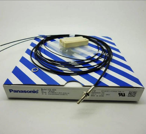 Single Replacement Fiber Optic Sensor FD43G for Industrial Automation on packaging, coiled fiber cable.