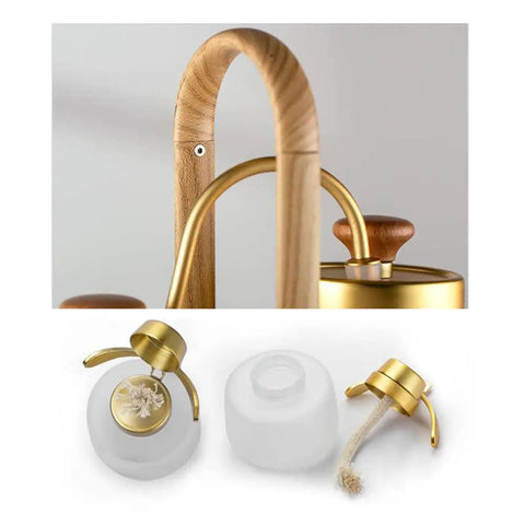 Top Shelf Belgian Siphon Coffee Maker With Clear Glass Chamber And Sleek Silver Base showing the stylish wooden handle and brass fittings.