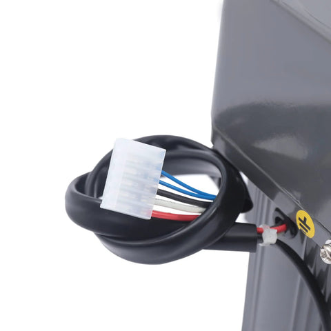 Close-up of 110V gear reduction motor wiring with white multi-pin connector on gray metal housing