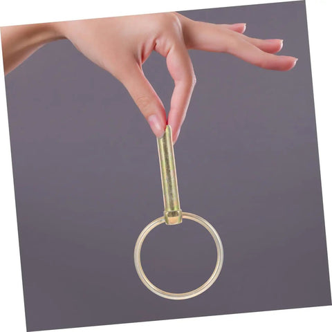 Hand holding a clevis pin and safety pin from the 12 Piece Heavy Duty Clevis Pin And Safety Pin Kit With Hitch Ring Clips For Secure Fastening.