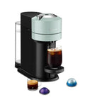 Vertuo Next Coffee And Espresso Maker By De'Longhi Turn Your Kitchen Into A Local Coffee Shop With Fast Heat Up Crema Rich Brew Coffee Or Espresso In One Go Multiple Cup Sizes Sleek Compact Design For Everyday Use, shown in jade color with coffee capsules