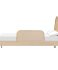 Side view of Taupe Twin And Full Bed Guardrail For Kiddo, Non Toxic Finish, GREENGUARD Gold Certified, on a wooden bed