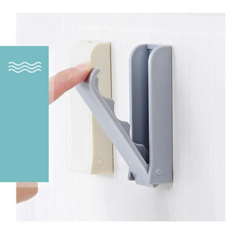 Slick Foldable Wall Hooks Self Adhesive Space Savers For Hats Bathrobes Coats Heavy Duty Peel Stick Easy Install shown in use.