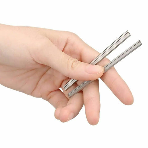 Double Edged High Speed Steel Planer Blades Reversible Jointer Knives Pack Of Ten Heavy Duty Woodworking Replacement Parts held in hand
