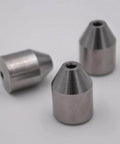 Front view of three 3/8-inch bullet-coned inserts, metal waterjet tool parts