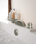 Two Handle Tub Mount Roman Tub Faucet In Brushed Nickel Finish With Easy Three Hole Installation Lead Free Construction Quarter Turn Ceramic Cartridges Pressure Tested Modern Bath Upgrade For A Sleek Durable Dope Look installed on bathtub