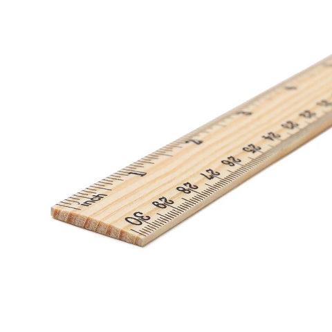 Close-up of a 12 inch wooden ruler showing dual metric and inch scales for school and DIY projects.