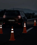 Car approaching 28 Inch Collapsible Traffic Safety Cones Pack Of 4 With Reflective Collar, Ultra Visible Orange for roadside setup