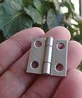 Close-up of a Mini Duty Stainless Steel Hinge with four screw holes for Jewelry Boxes and Wooden Boxes Small Hardware.