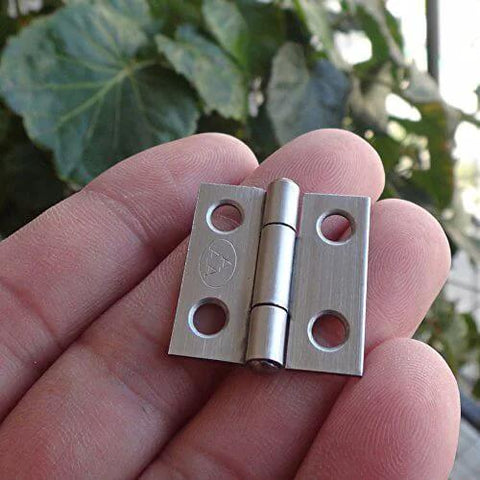 Close-up of a Mini Duty Stainless Steel Hinge with four screw holes for Jewelry Boxes and Wooden Boxes Small Hardware.