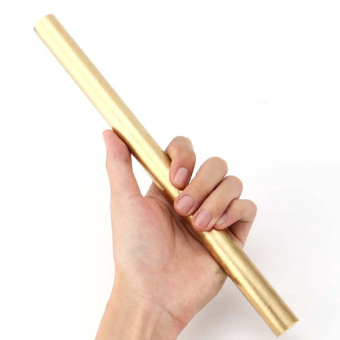 Two Pack 1 Inch Diameter Brass Rod Lathe Bar 12 Inch Length Brass Bar Stock held in hand, ideal for DIY crafts and model making.