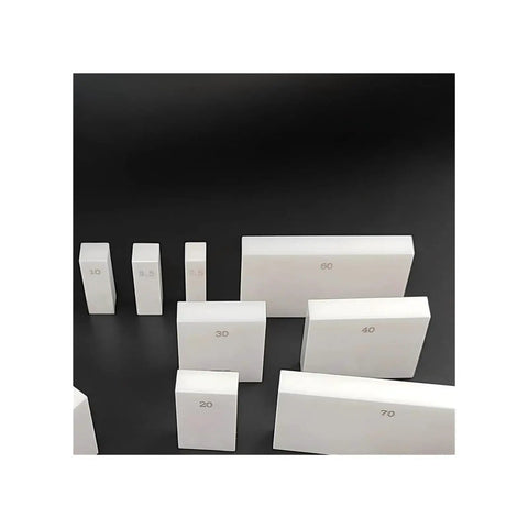 83 Piece Ceramic Rectangular Gauge Block Set Real Deal Grade Zero Precision For Micrometers And Calipers stacked in various sizes.