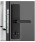 Keyless Entry Smart Lock With Slick Touchscreen Handle And Fingerprint Door Lock Electronic Deadbolt For Front Doors close-up of black aluminum alloy lock with touchscreen and handle.