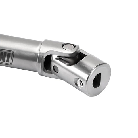 Close-up of stainless steel center drive shaft for FCX24M Defender 1/24 RC crawler with D-shaped connection visible.