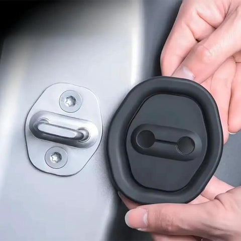 Hands installing Rock Solid Silicone Car Door Lock Cover on Nissan Rogue door latch, black silicone guard for moisture protection.