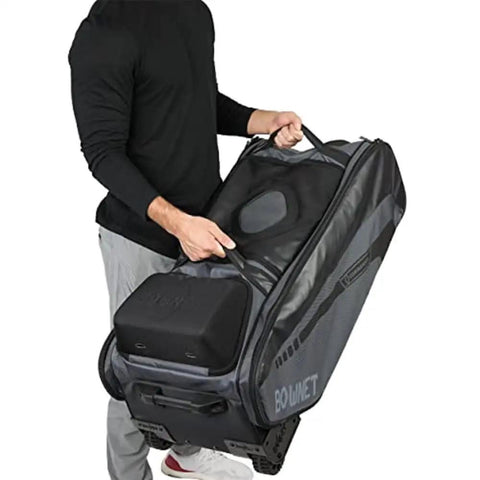 Person using Commander Catchers Gear Bag With Wheels For Travel And Outdoor Play Black Rugged Durable Equipment Carrier