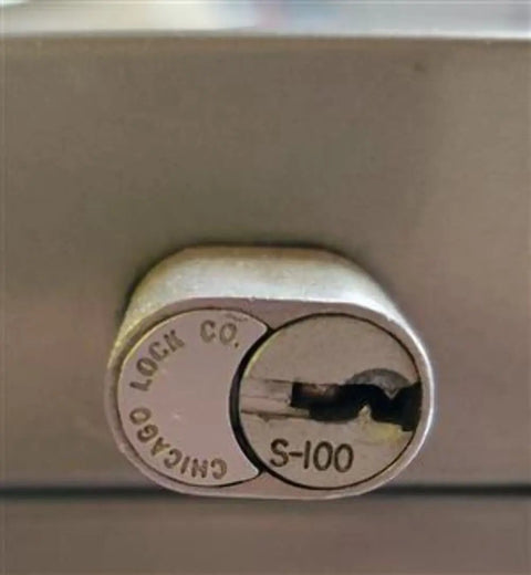 Close-up of S100 lock on a cabinet, highlighting compatibility with Heavy Duty Office Cabinet Replacement Key For S110 Core.