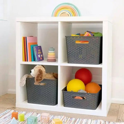 Kick Clutter To The Curb With This Big Slick Gray Woven Storage Basket Featuring Sturdy Cut Out Handles For Roomy Home Organization And Chic Display ThatSeriously Saves Valuable Floor Space Now in a shelving unit filled with toys.