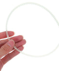 Four Pack Heavy Duty Rubber Replacement Belts For Sealing Machines featuring precise tooth design held in hand for demonstration.