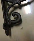 Hella Sturdy Rock Solid Cast Iron Wall Mounted Corner Support Brackets With A Killer Vintage Floral Design For That Top Shelf Rustic Industrial Home Decor Look, detailed close-up view.