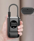 Road Ready Portable Tire Inflator For Kia Soul And Soul Ev 2010 Through 2025 Digital Air Compressor with LED light in hand.