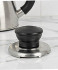 Upgrade Your Kitchen Game With This Heavy Duty Stainless Steel Whistling Kettle Lid Knob Replacement Kit. Super Loud Squeal Design For Easy Boiling Detection, Durable Build Quality That Lasts A Lifetime, And Simple Tool Free Install Perfect For Pro Chefs. Stainless steel kettle lid knob replacement kit on countertop, black knob with silver base