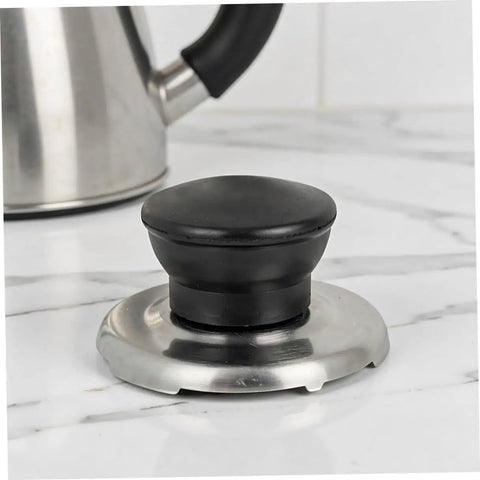 Upgrade Your Kitchen Game With This Heavy Duty Stainless Steel Whistling Kettle Lid Knob Replacement Kit. Super Loud Squeal Design For Easy Boiling Detection, Durable Build Quality That Lasts A Lifetime, And Simple Tool Free Install Perfect For Pro Chefs. Stainless steel kettle lid knob replacement kit on countertop, black knob with silver base