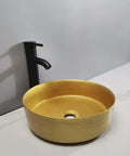 Bathroom Sink Bathroom Sink Home Bathroom Vessel Sink Modern Art Basin Hotel Apartment Bathroom Wash Basin Round Golden Counter Basin Bathroom Sink Vessel on countertop with black faucet.