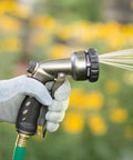 Seven Spray Patterns Garden Hose Nozzle With Easy Turn Dial And Flow Control For Precise Watering Of Lawns Pots And Garden Beds Comfortable Grip Works Wet Or Dry Durable And Easy To Use in hand spraying water