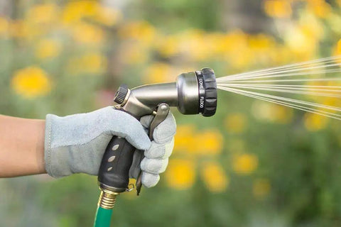 Seven Spray Patterns Garden Hose Nozzle With Easy Turn Dial And Flow Control For Precise Watering Of Lawns Pots And Garden Beds Comfortable Grip Works Wet Or Dry Durable And Easy To Use in hand spraying water