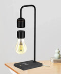 Unique Modern Levitating Lamp With Floating Light And Built In Qi Wireless Charger Sleek Dope Design Warm Decorative Night Light For Home Office And Bedroom Touch Control On Off For Any Room shown on a desk with a soft glow.