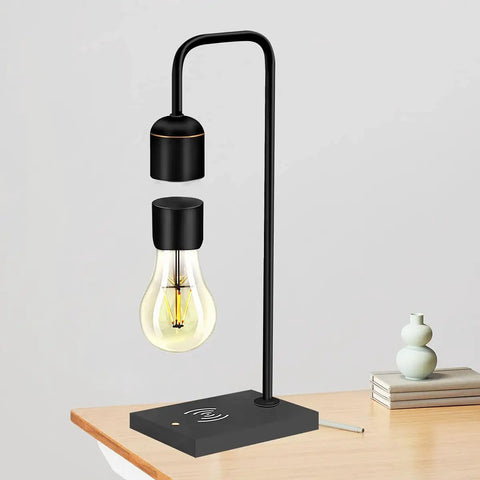 Unique Modern Levitating Lamp With Floating Light And Built In Qi Wireless Charger Sleek Dope Design Warm Decorative Night Light For Home Office And Bedroom Touch Control On Off For Any Room shown on a desk with a soft glow.