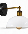 Industrial Dome Wall Sconce, White, 180° Adjustable Vintage Wall Light with white dome shade and brass arm mounted on black wall.