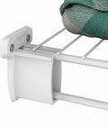 Heavy Duty Preloaded Sidewall Brackets With Anchors For Wire Shelving 500 Pack installed on wire rack holding folded blanket.