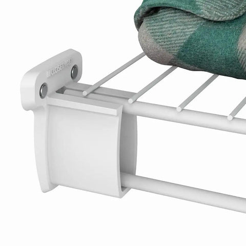 Heavy Duty Preloaded Sidewall Brackets With Anchors For Wire Shelving 500 Pack installed on wire rack holding folded blanket.