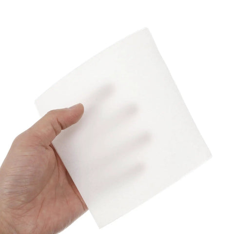 Hand holding a six inch Top Shelf Lint Free Cleaning Wipes oil absorbing cleanroom cloth for office desks and screens.