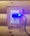 Six Foot 9V AC DC Power Adapter For Roland Boss RC 3 Loop Station plugged into wooden wall outlet with glowing blue light