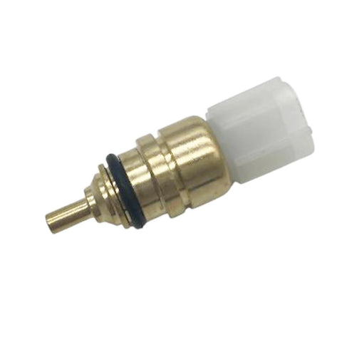 Engine coolant temperature sensor, brass body with white plastic connector, close-up
