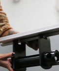 Person adjusting 4 Pack Sliding Trailer Winches For LL Track Double L Tracks, Heavy Duty Flatbed Truck Winches, side view