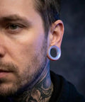 Man wearing Lavender Opalite Hollow Glass Ear Plugs Gauges 10mm To 00 Gauge Hollow Tunnel Ear Stretchin Saddle Style
