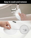 TKOWTB Bathtub Drain Stopper Silicone Drain Plug with Strong Suction Seal being easily washed under faucet.