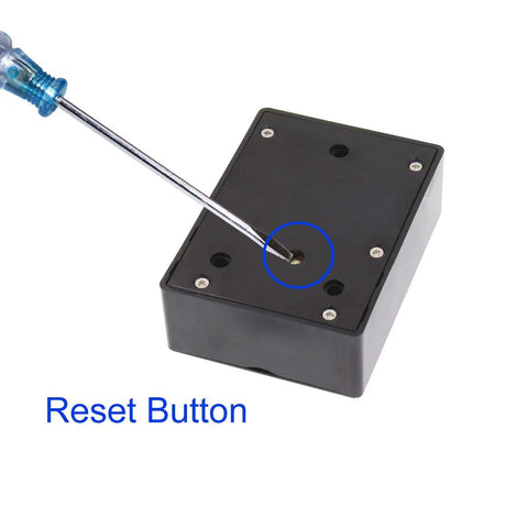 Back view of Hidden RFID Electronic Cabinet Lock For Wooden Cabinets, Drawers, And Cupboards, with a screwdriver on the reset button.