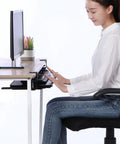User typing on the Rock Solid Retractable Keyboard Tray with slick pull-out action, under a desk, in a clutter-free setup.