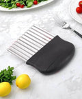Crinkle cutter with stainless steel blades and black plastic handle for potatoes and vegetables.