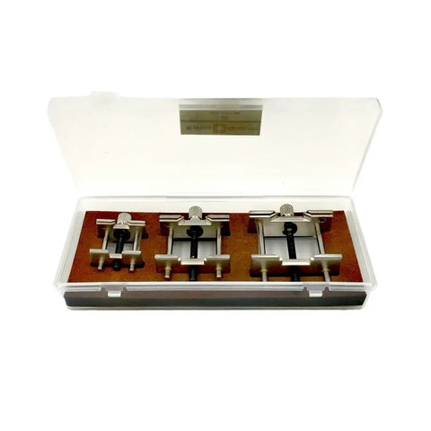 Aluminum Alloy Watch Movement Holder Kit in plastic case, includes three adjustable metal holders for watchmakers and hobbyists.