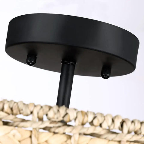 Close-up of black canopy with woven details on Rattan Semi Flush Mount Ceiling Light With Black Canopy 2 Light 12 Inch Drum Shade Fixture.
