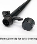 Close-up of drip emitter stake with removable cap from 25 Adjustable Drip Irrigation Emitters With Stakes 0 To 18 GPH Flow 360 Degree Sprinkler Heads For Garden Lawn Flower Beds Patio Micro Irrigation System Easy DIY Budget Friendly Watering Solution.