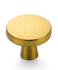 Heavy Gauge Brushed Brass Cabinet Knobs 5 Pack Featuring Smooth Round Edges And Top Shelf Solid Build To Fast Track Your Kitchen Remodel And Make Every Drawer Look Absolutely Sick - close-up view of a brass cabinet knob.