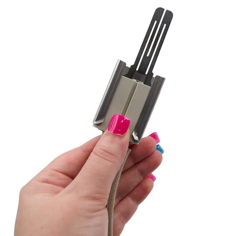 Hand holding WB13X25633 Glowbar Gas Range Igniter Replacement, beige and metal, model specific not universal